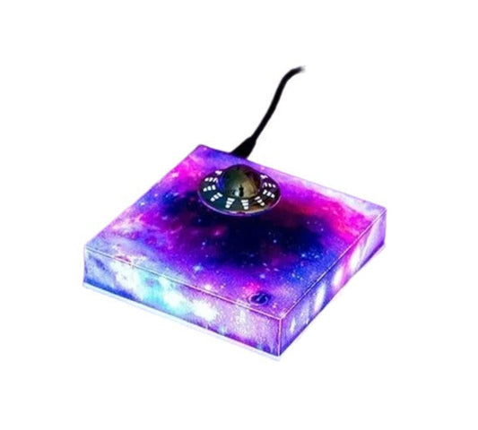 Magnetic levitating UFO ornament with 360° rotation and LED starry sky lighting—perfect for home and office decor.